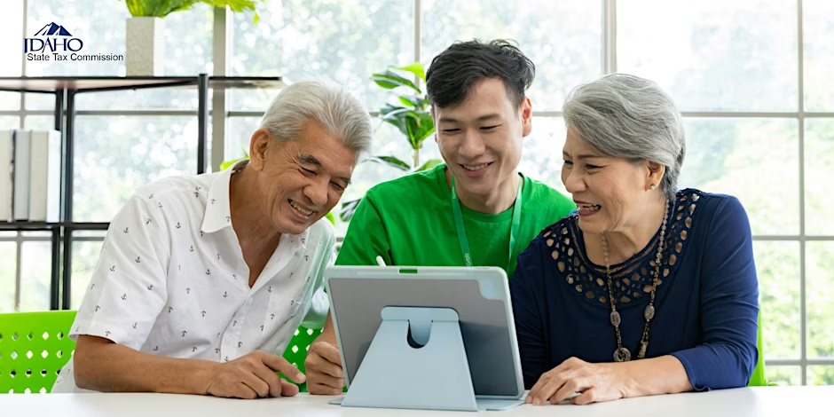 Parents working with their son at a laptop computer. Class name: Idaho Parental Choice Tax Credit (HB 93) and TAP in-person event